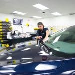 Man Cleaning Windshield