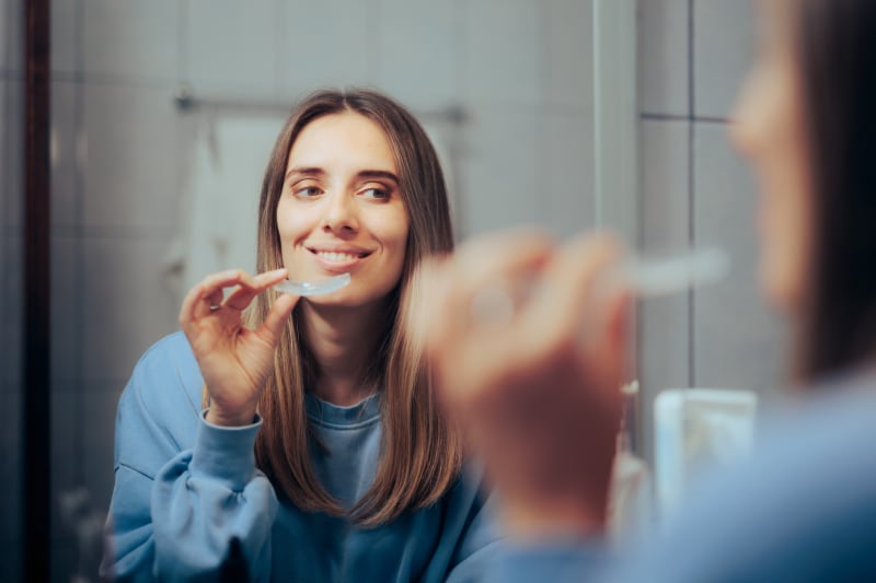 Patient holding a clear removable retainer