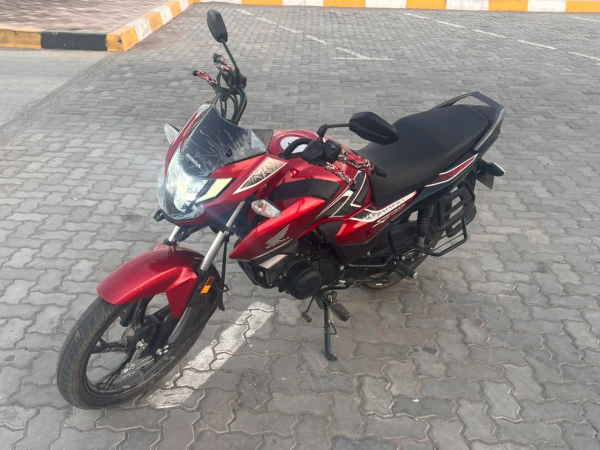 Moto Honda XP125 rouge en très bon état à vendre