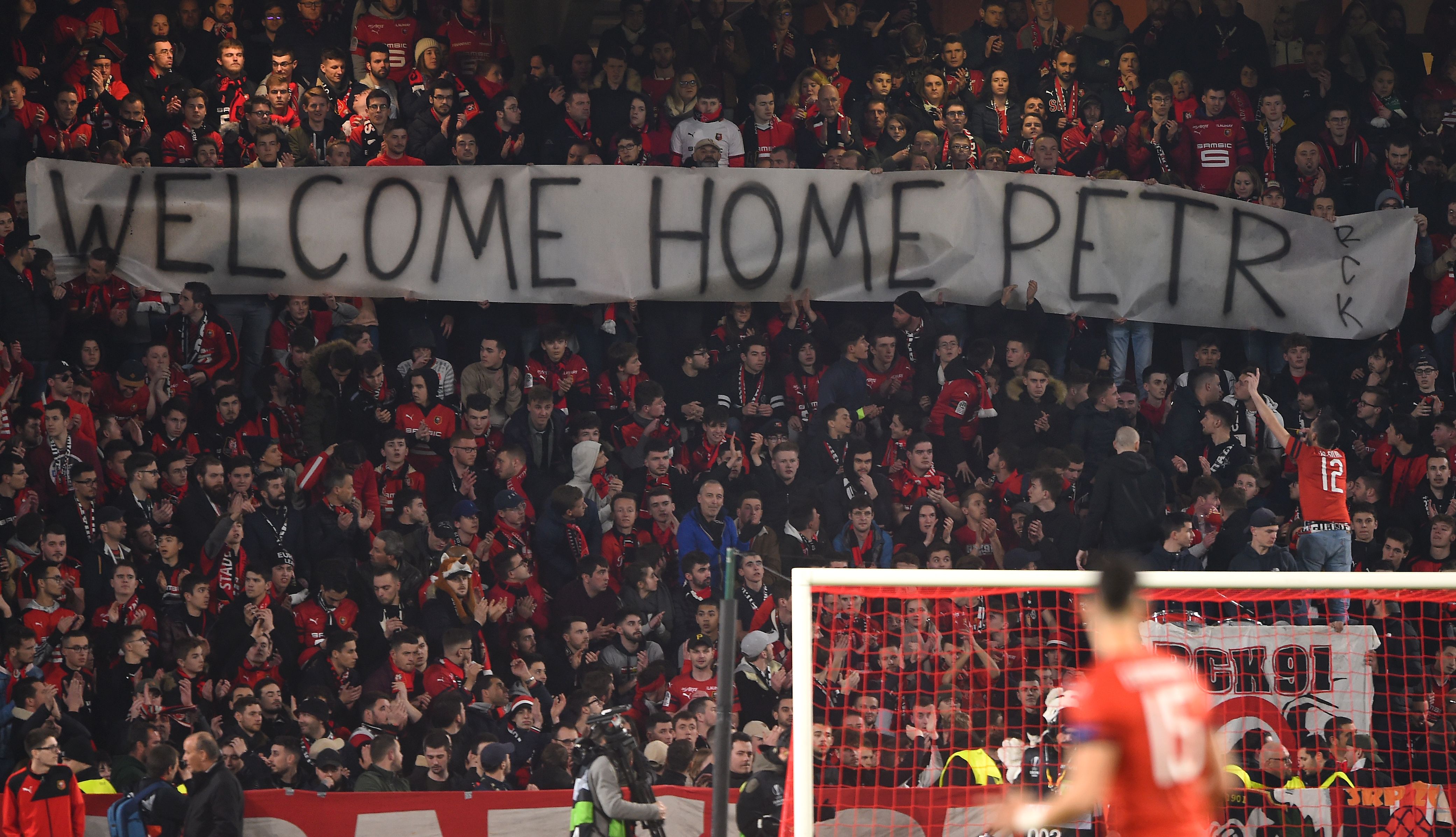 A banner reading 'Welcome Home Petr' in the stands at Stade Rennais as Arsenal play the French club (Goalkeeper.com)