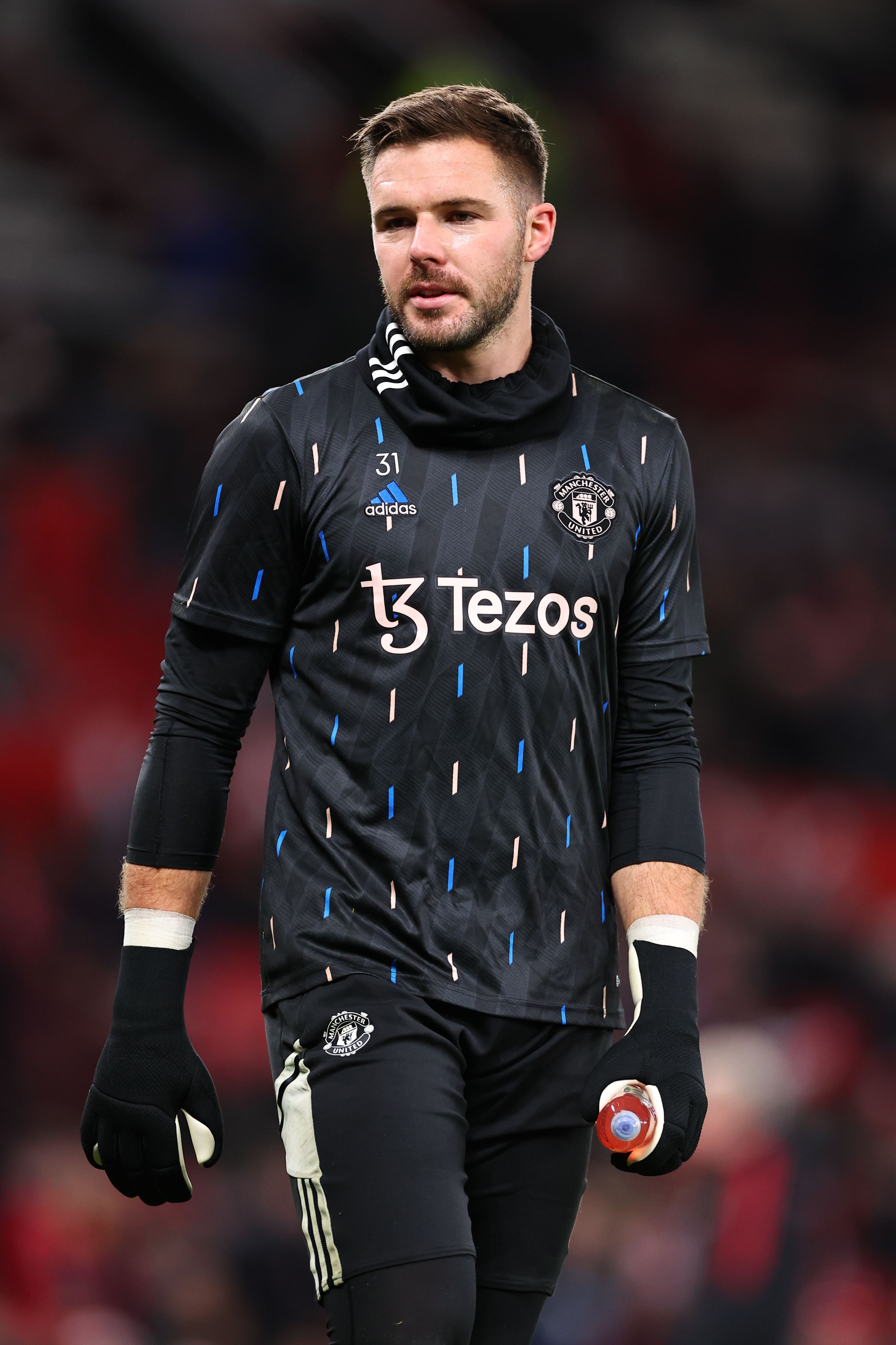 Butland wearing blacked out goalkeeper gloves