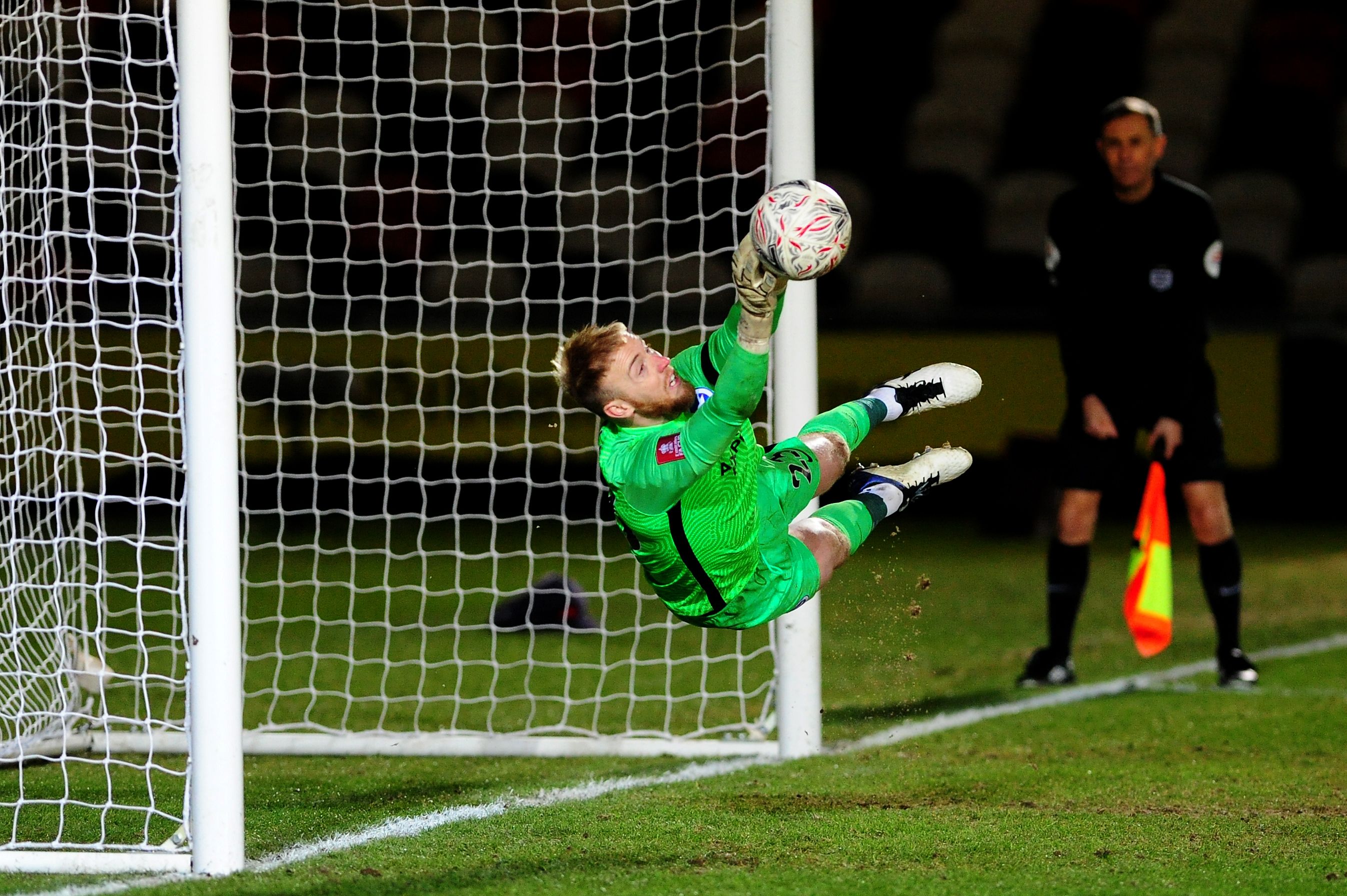 Jason Steele saves a penalty for Brighton against Newport County in the FA Cup (Goalkeeper.com)
