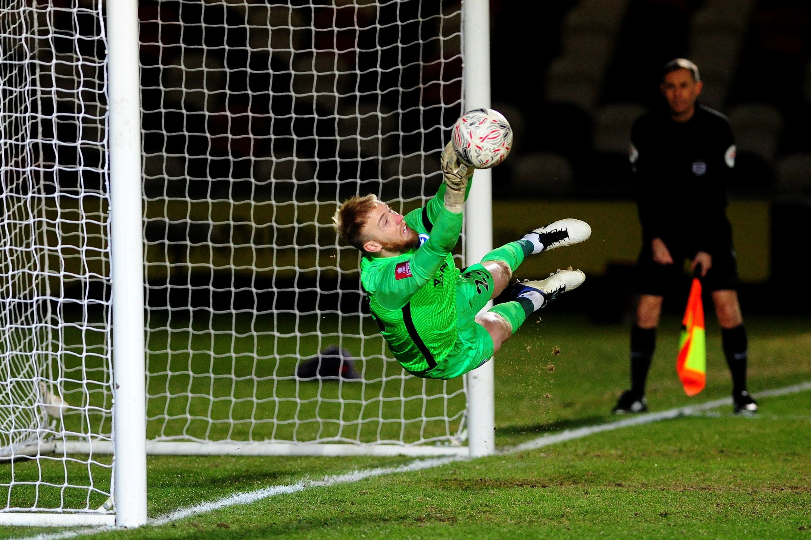 Jason Steele saves a penalty for Brighton against Newport County in the FA Cup (Goalkeeper.com)