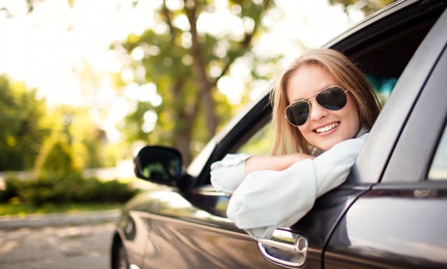 Woman looking out of car window