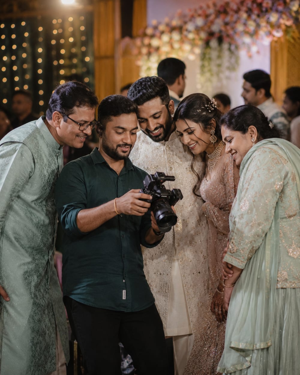 A newly married couple celebrating with their family