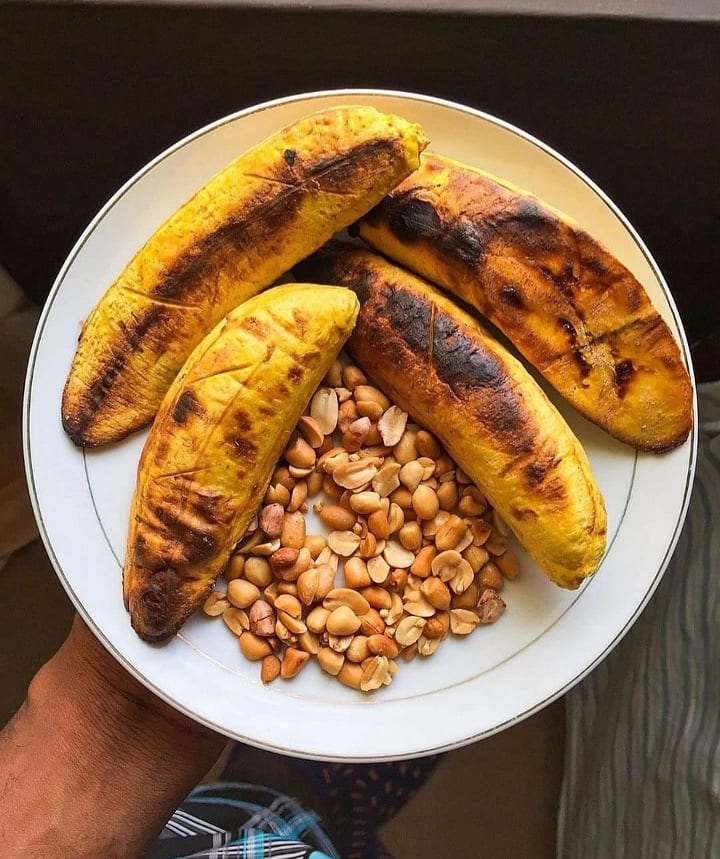 Charcoal-roasted plantain served with groundnuts in Ghana
