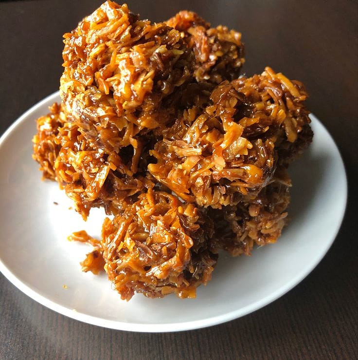 Round pieces of Ghanaian kube cake made with grated coconut