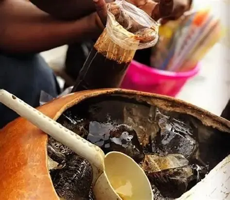 A bottle of Ghanaian asaana, a caramelised maize drink
