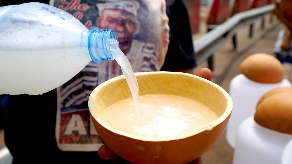 Fresh Ghanaian palm wine served in a traditional setting