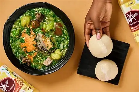 Freshly prepared Ghanaian banku shaped into a smooth mound