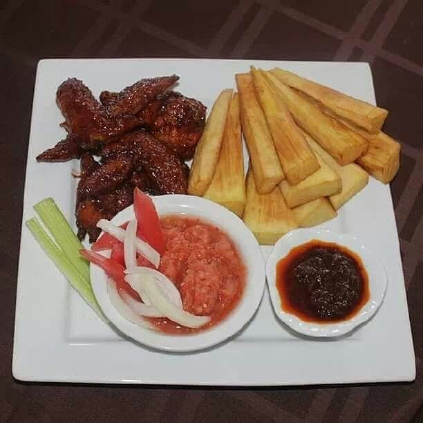 Ghanaian fried yam served with dark shito pepper sauce