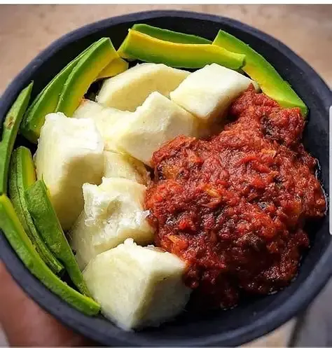 Boiled plantain ampesi served with kontomire stew