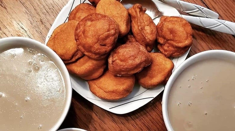 A Ghanaian breakfast of Hausa koko millet porridge and koose bean cakes