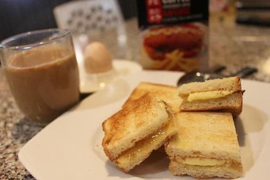 A Ghanaian breakfast of milk tea, toasted bread and egg