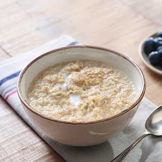 A bowl of cooked oats porridge ready for breakfast
