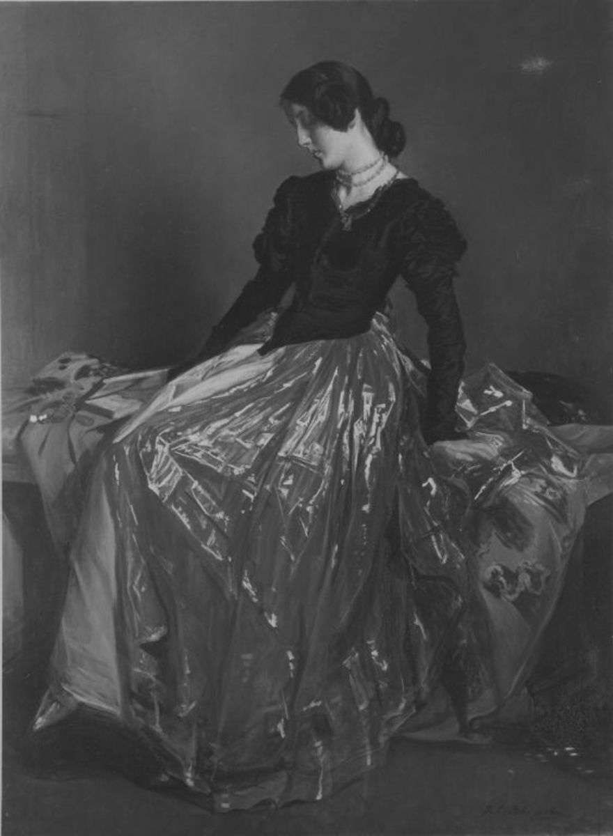 Sinnende Frau mit Buch auf einer Bank