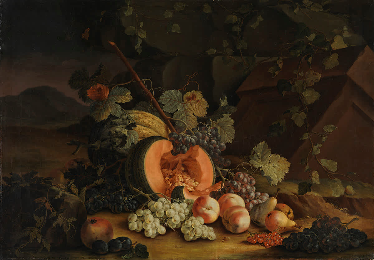 Stillleben mit halbierter Melone und Weintrauben