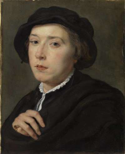 Junger Mann mit schwarzem Barett