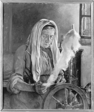 Alte Bäuerin beim Spinnen