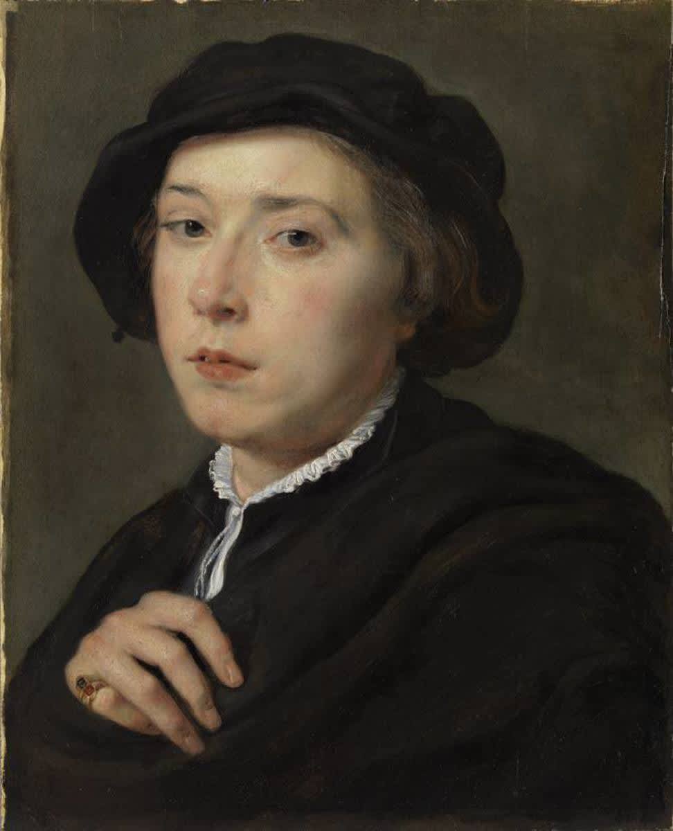 Junger Mann mit schwarzem Barett