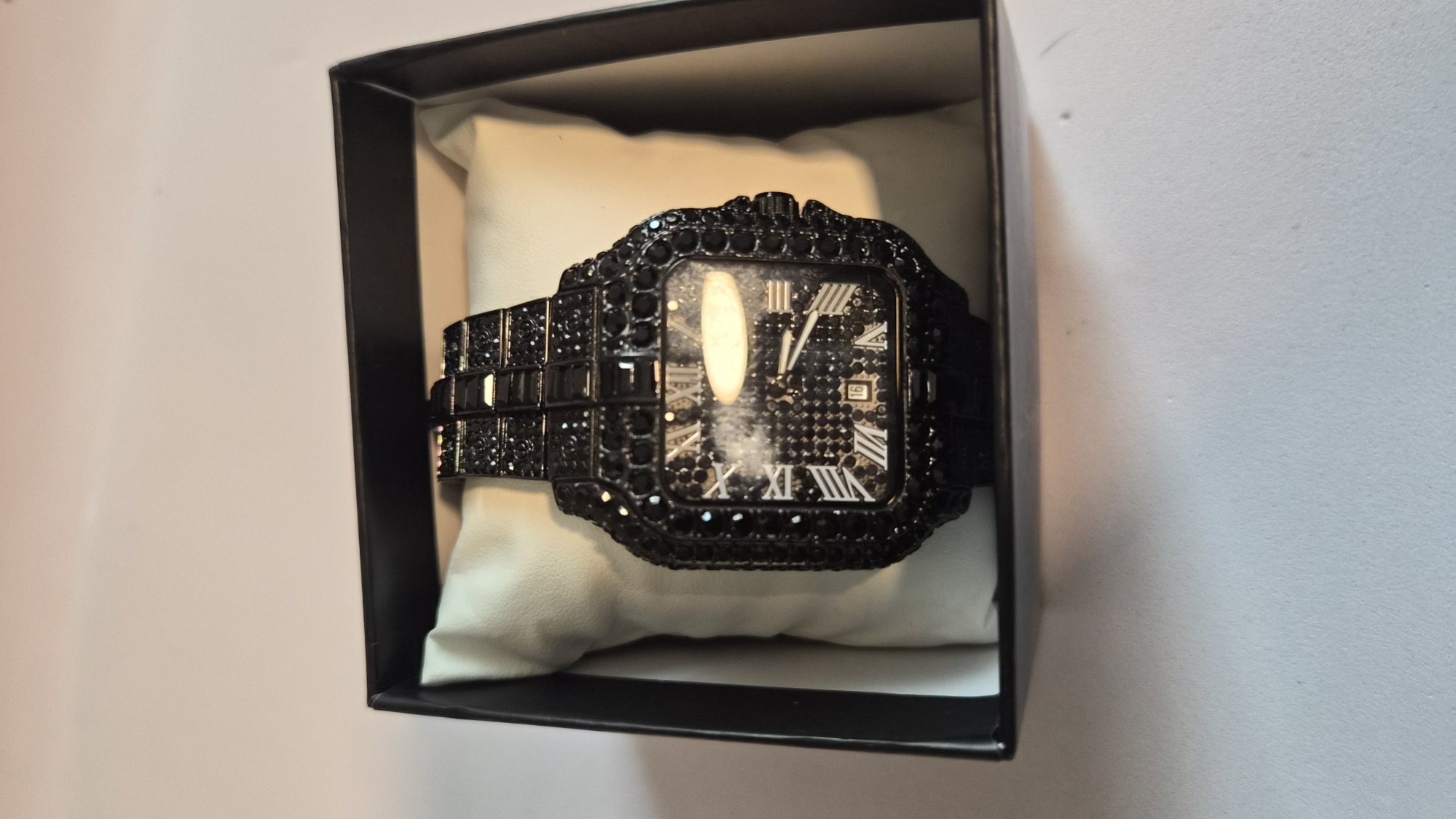 "Bust down" style luxury timepiece