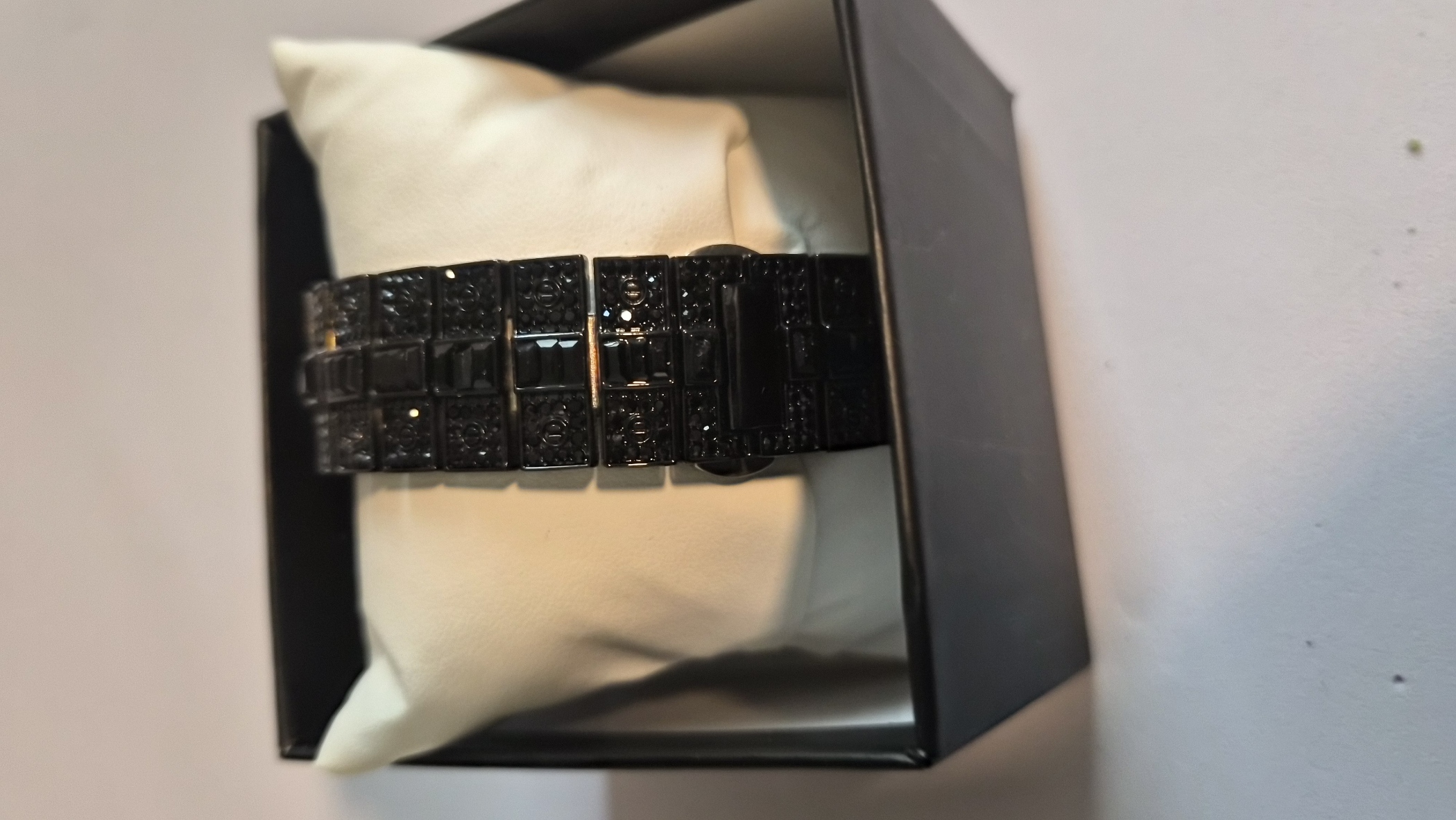 "Bust down" style luxury timepiece