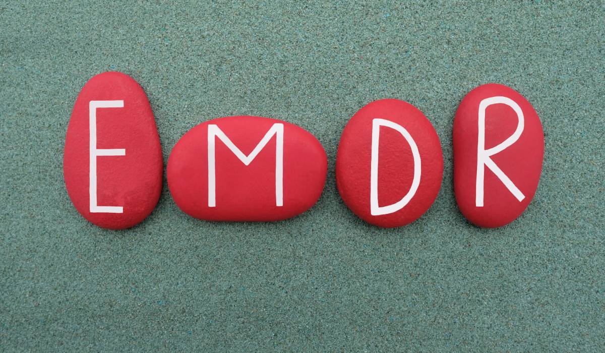 Red stones with the word emdr written on them.
