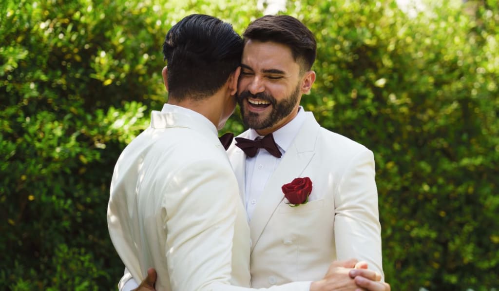 lgbtq marriage couple having romantic moment together after wedding ceremony