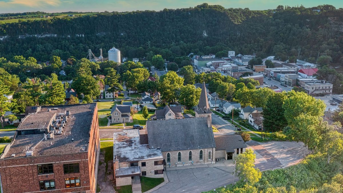 Scenic aerial view of Lanesboro, MN featuring lush greenery and historic buildings.