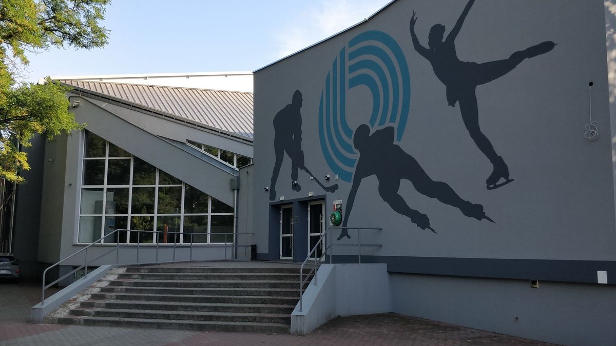 SportsShoes.com tech chief on retail future Contemporary ice rink entrance featuring a dynamic skating mural outside.