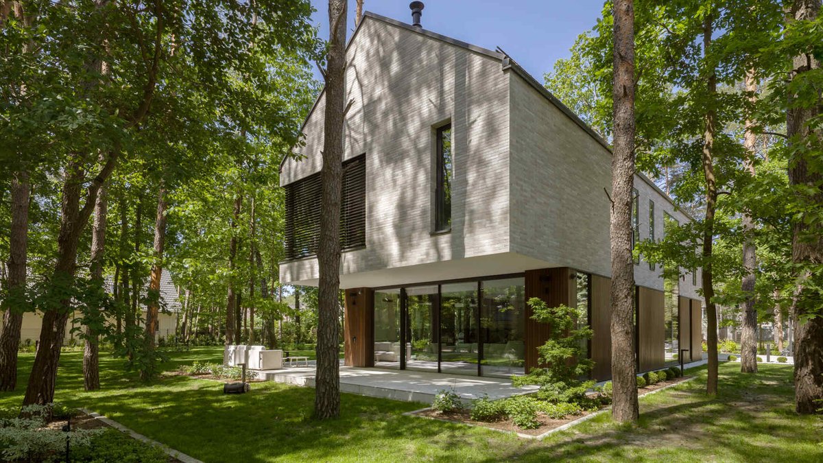 Two intersecting volumes give The Intersecting House near Warsaw its distinctive form.