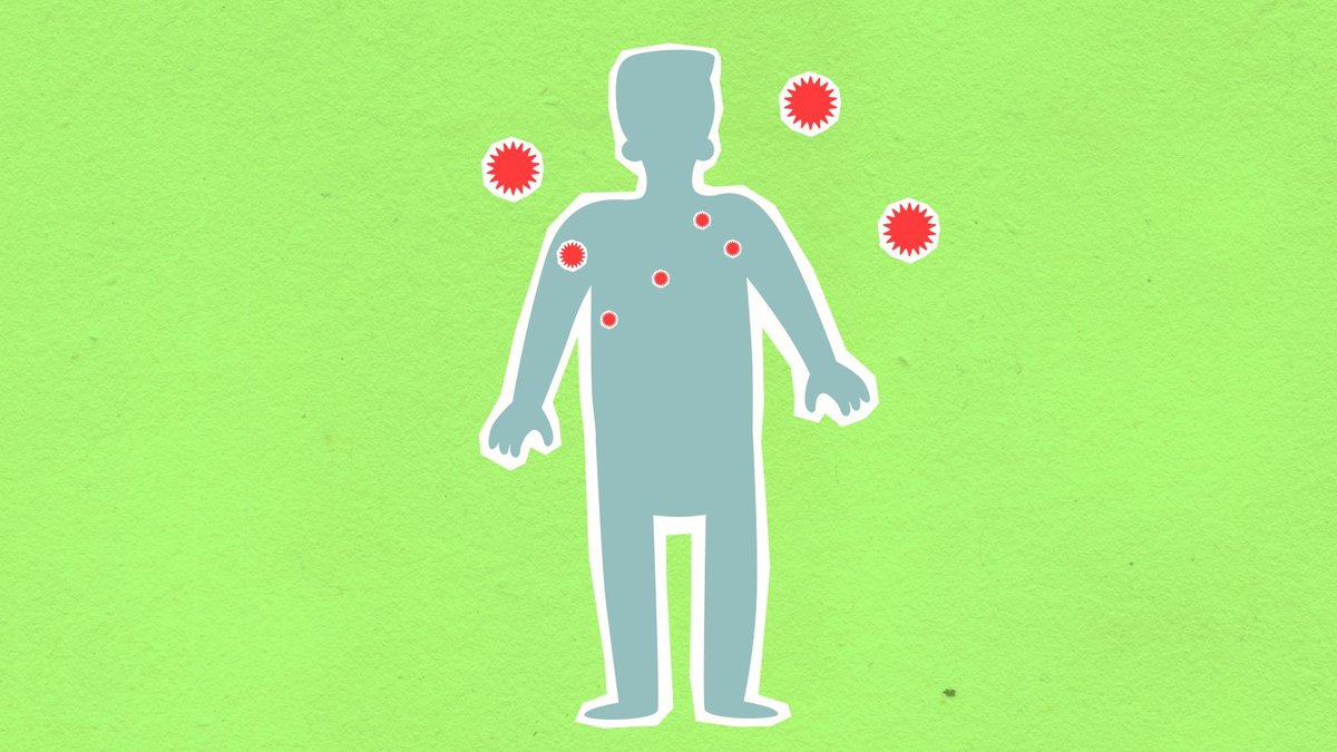 Paper cutout of male silhouette surrounded with many spreading contagious red viruses on green background during dangerous co