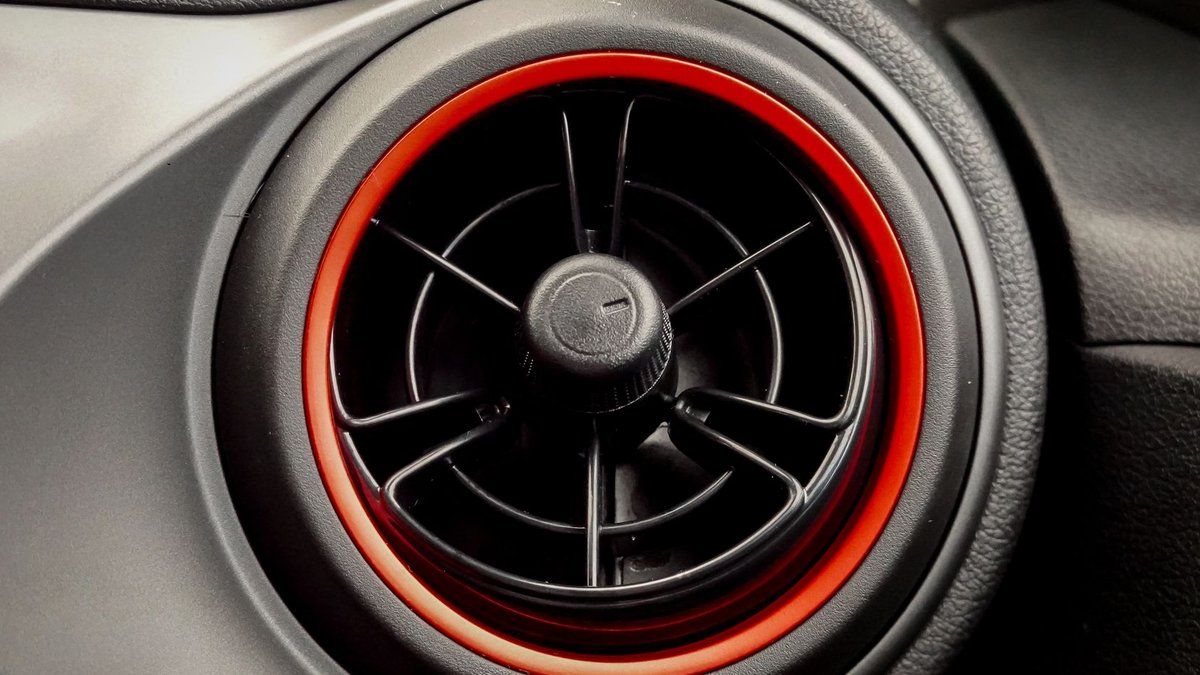 Westlake Royal secures exclusive PVC trim deal with BlueLinx Close-up of a circular car air vent with stylish red trim. Ideal for automotive themes.