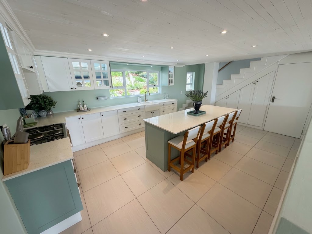 Kitchen island beneath pendant lighting