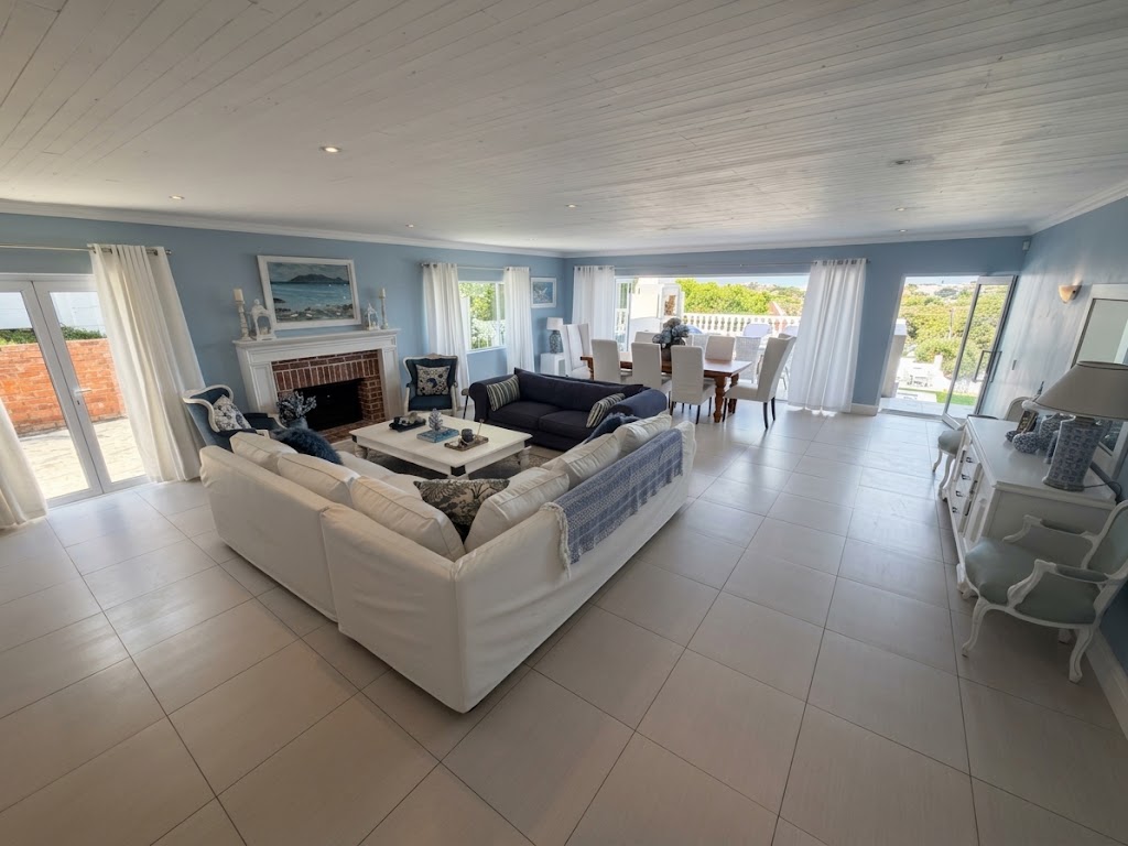 Spacious Grand Lounge with sofas and fireplace