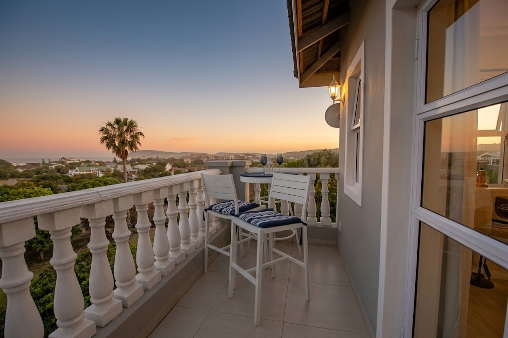 Private suite deck overlooking Plettenberg Bay at sunset
