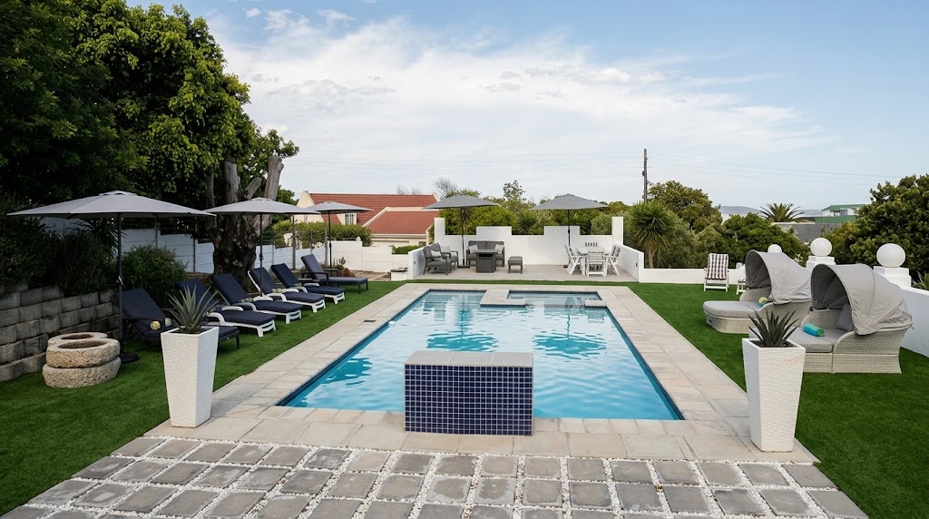 The Oasis at Seeviews Villa framed by sun loungers and umbrellas