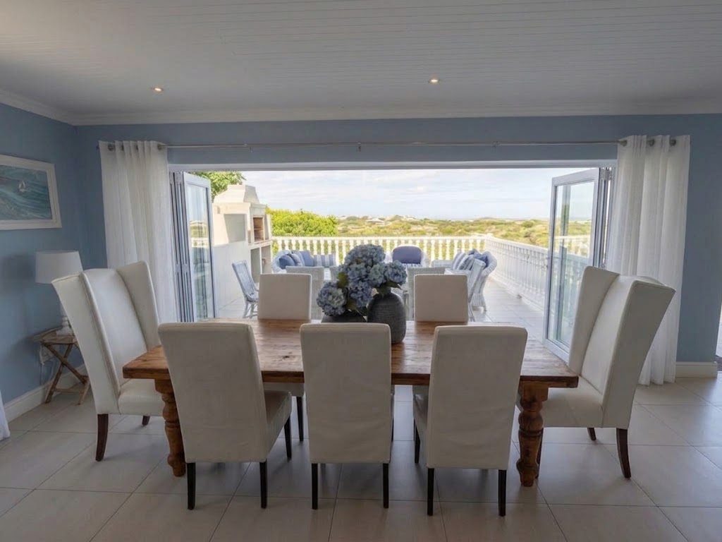 Dining Room table opening onto the terrace and bay view