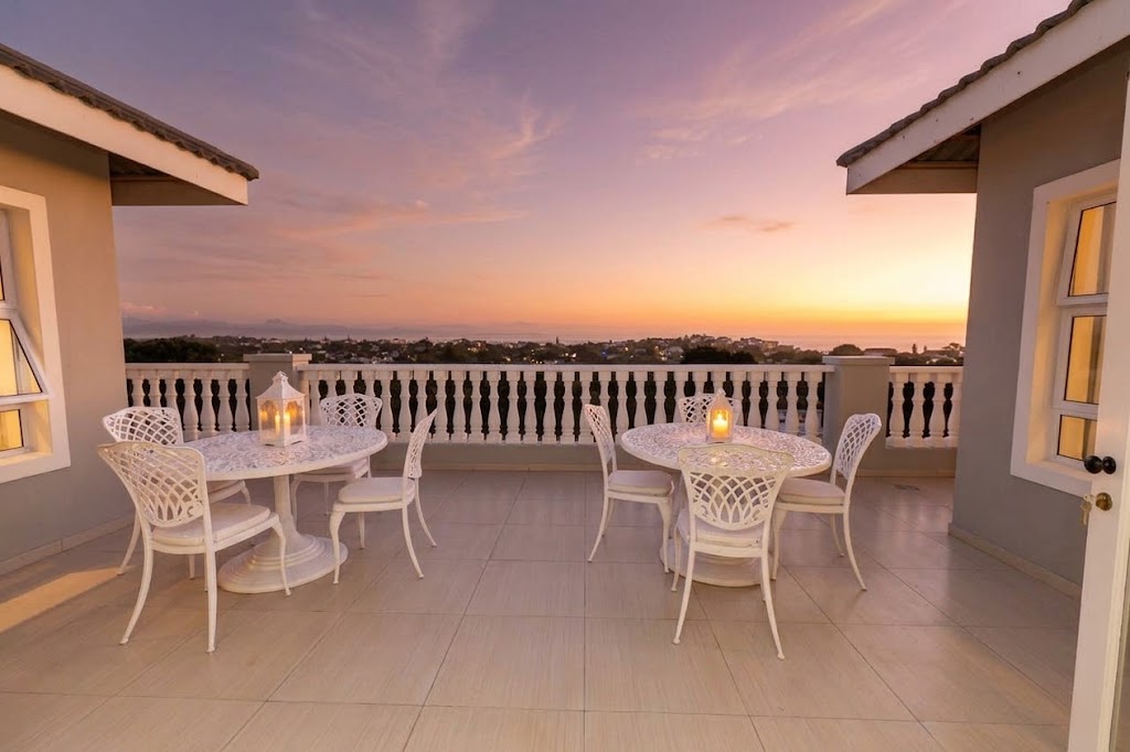 Outdoor Deck tables overlooking the bay at sunset