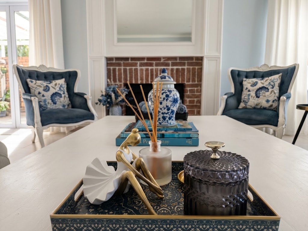 Coffee table arrangement and blue accent chairs in the Grand Lounge