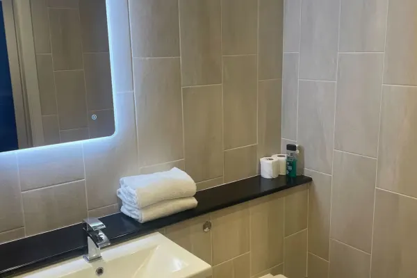 1BR Apt • Balcony • Smart TVs in All Rooms - Image 12