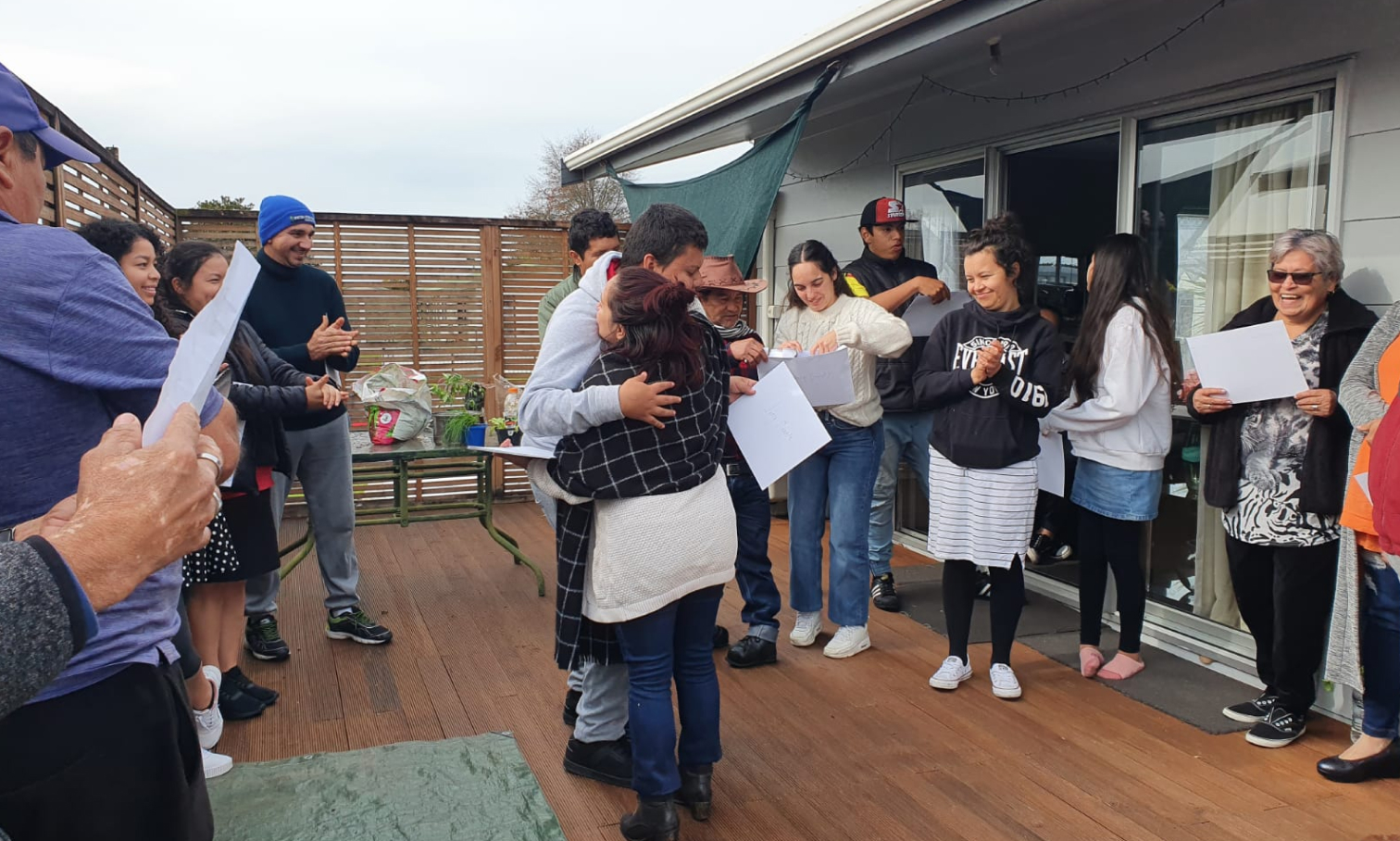 Group of Latin American immigrants in Hamilton celebrating getting their certificates