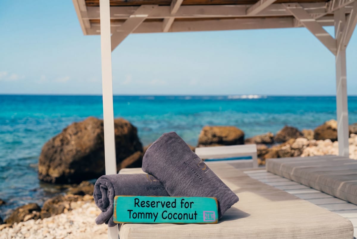 Day beds by the sea at Jan Thiel, reserved for Tommy Coconut guests.