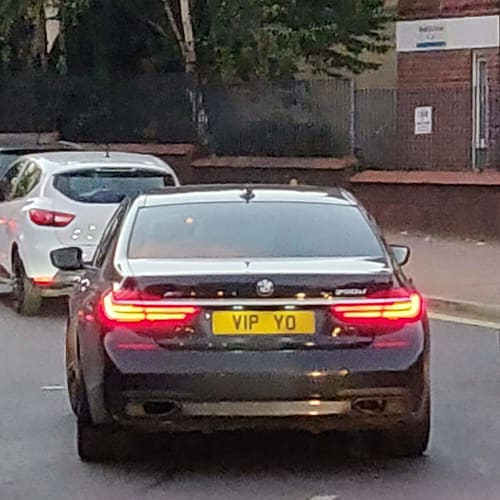 A close-up of a car number plate