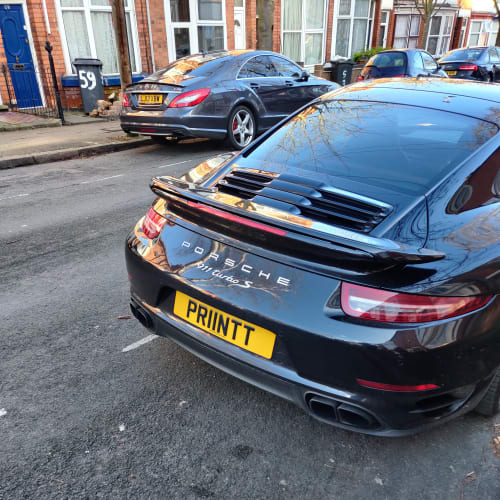 A close-up of a car number plate