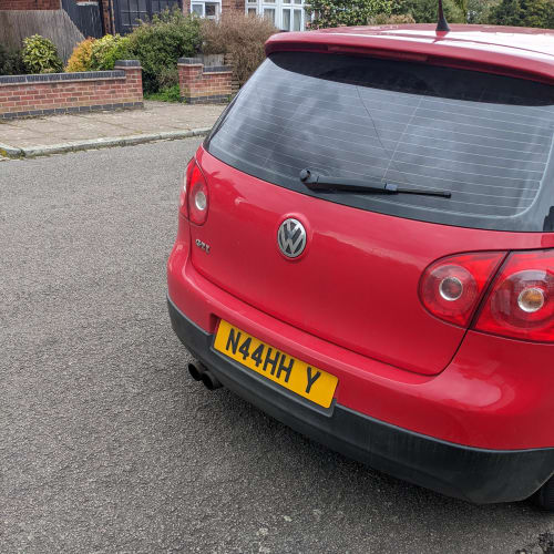 A close-up of a car number plate