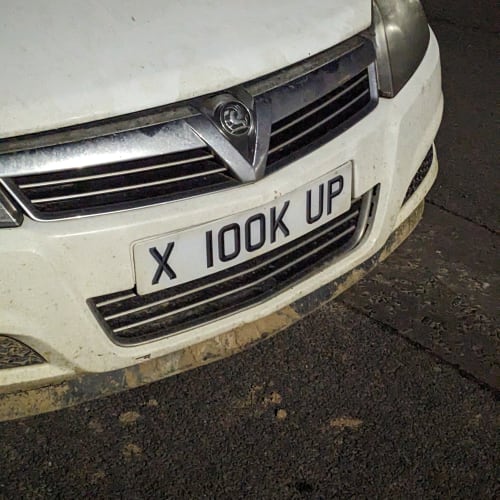 A close-up of a car number plate