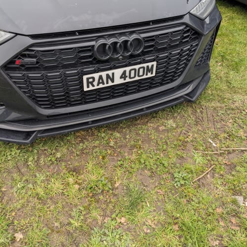 A close-up of a car number plate