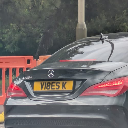 A close-up of a car number plate