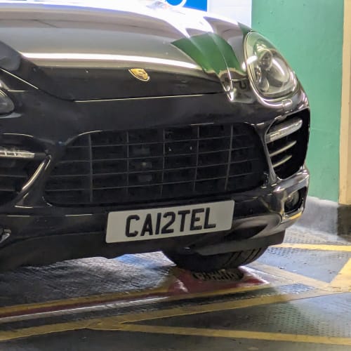 A close-up of a car number plate